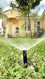using a pop up head irrigation system to keep you lawn green saves you time and money